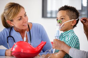 child using nebulizer